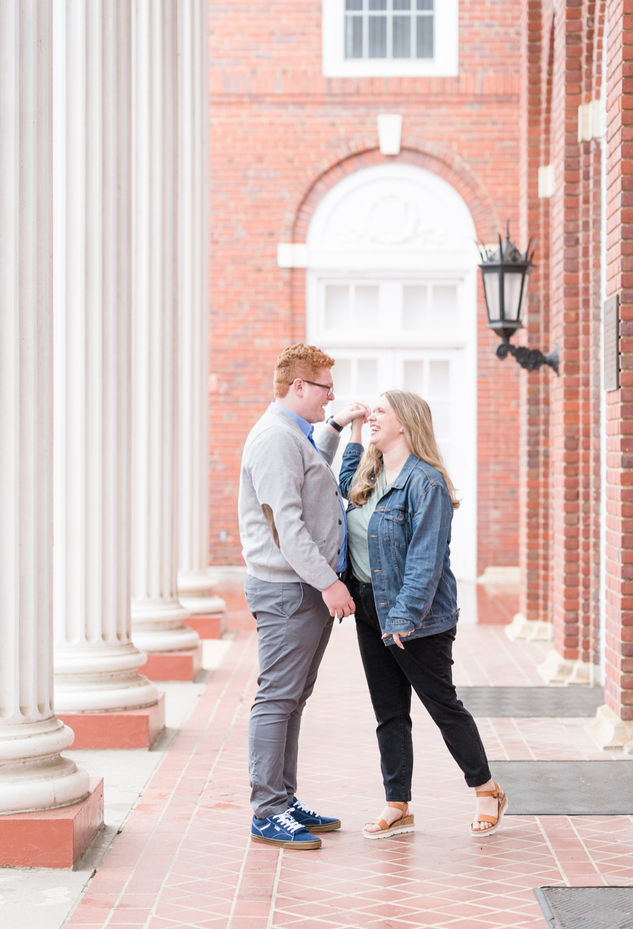 couple laughs for engagement photography