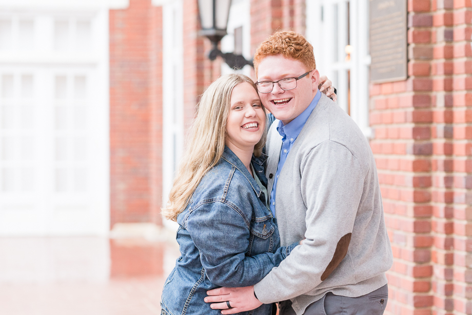 couple laughs for engagement photography